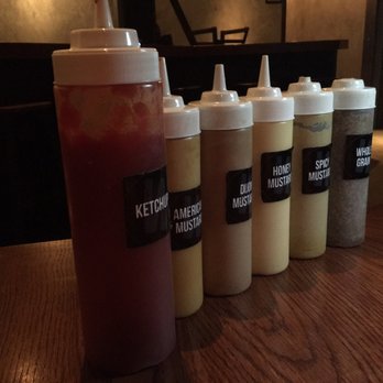 Wursthaus - Condiments on the tables. - Pubs Near Me - Santa Ana, California