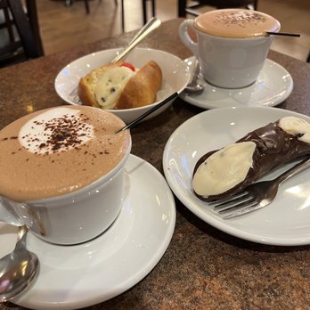 DeLillo Pastry Shop - Chocolate covered cannoli, Baba Au Rum & macchiatos - Bakeries Near Me - Bronx, New York