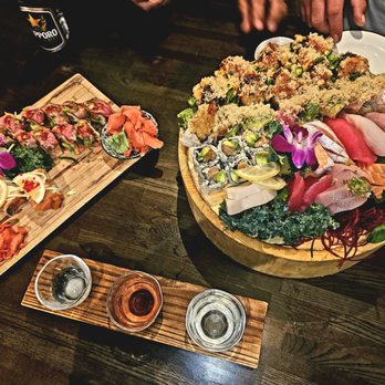 AMA Sushi - Specials on the left, sushi bowl on the right Enough for 4 people!!! - Sushi Bars Near Me - Edina, Minnesota
