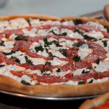 Bravo Pizzeria & Restaurant - pizzas on a table - Pizza Near Me - Flushing, New York Bravo Pizzeria & Restaurant - pizzas on a table - Pizza Near Me - Flushing, New York