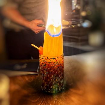 H Tasting Lounge - FRUTERÍA2.5OZ 24 leblon cachaça, villa lobos 55 tequila, green chartreuse, chamoy syrup, guava, flamed husk - Lounges Near Me - Vancouver, British Columbia