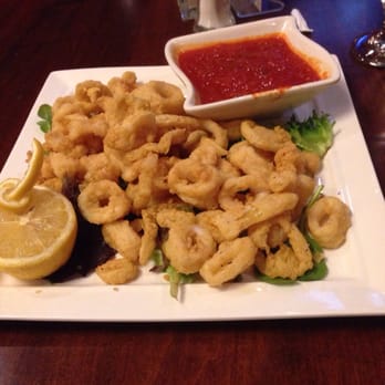 Park City Grill - a plate of fried calamails with a side of ketchup - American Near Me - Bridgeport, Connecticut Park City Grill - a plate of fried calamails with a side of ketchup - American Near Me - Bridgeport, Connecticut