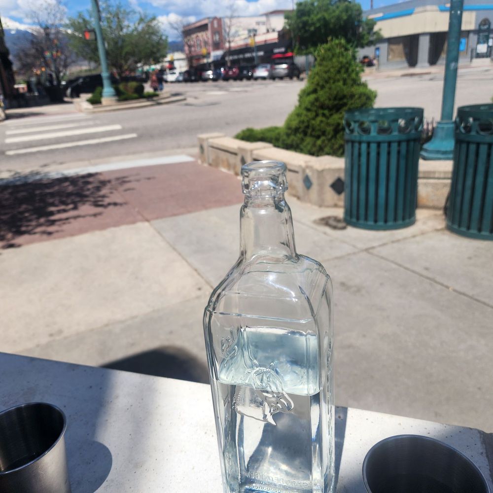 Dos Dos - Water bottle and outdoor on the patio. - Mexican Near Me - Colorado Springs, Colorado