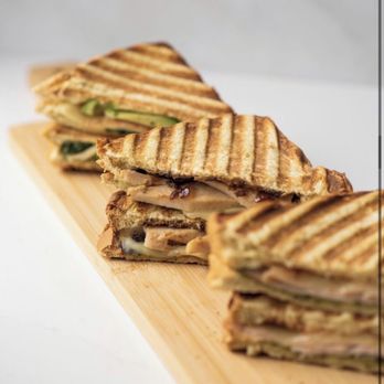 Jugo Juice - a grilled sandwich on a cutting board - Juice Bars & Smoothies Near Me - Langley, British Columbia Jugo Juice - a grilled sandwich on a cutting board - Juice Bars & Smoothies Near Me - Langley, British Columbia