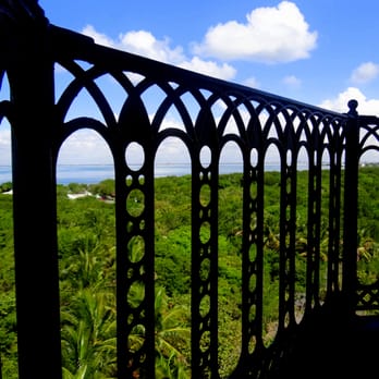 Cape Florida Lighthouse - I ducked down to capture the handrail of the platform, the blue sky, blue water, and the green palms below. - Landmarks & Historical Buildings Near Me - Key Biscayne, Florida