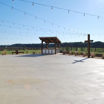 Rodgers Ranch - Outdoor event space with cross and two vendor stalls - Venues & Event Spaces Near Me - Wilmer, Alabama
