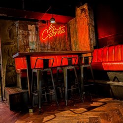 La Carnita - Neon sign and seating