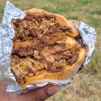 Datz Deli - The beef patty with coco bread and oxtail with peas and rice - Caribbean Near Me - Hollis, New York Datz Deli - The beef patty with coco bread and oxtail with peas and rice - Caribbean Near Me - Hollis, New York