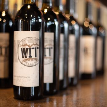 WIT Cellars - a row of wine bottles - Wine Tasting Room Near Me - Prosser, Washington