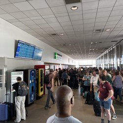 Dollar Car Rental - The line taking up the entire length of the car rental building.