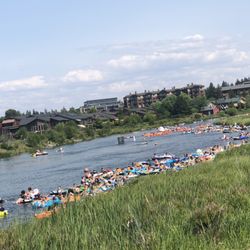 Bend River Floats - Long busy line of floaters waiting to walk out or go down the small rapids. Midways point for the route!!