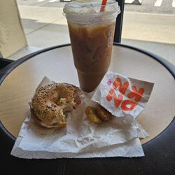 Dunkin' - Everything bagel with veggie cream cheese and butter. And cold brew with sweet foam
