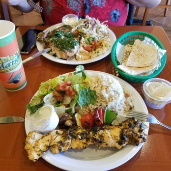 Chicken Maison - You can't tell but under the chicken plate is a pool of garlic oil that you do NOT want to waste! - Mediterranean Near Me - Gardena, California Chicken Maison - You can't tell but under the chicken plate is a pool of garlic oil that you do NOT want to waste! - Mediterranean Near Me - Gardena, California