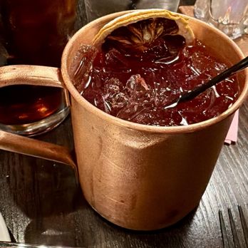 Coppermill Steakhouse - TRIPLE BERRY MULE Strawberry and Raspberry vodka, housemade blueberry puree, lemon juice, simple syrup, ginger berry. - Steakhouses Near Me - Kearney, Nebraska Coppermill Steakhouse - TRIPLE BERRY MULE Strawberry and Raspberry vodka, housemade blueberry puree, lemon juice, simple syrup, ginger berry. - Steakhouses Near Me - Kearney, Nebraska
