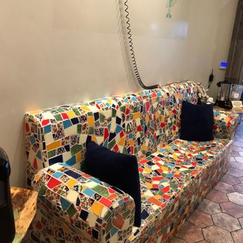 Cantina Del Sol - a couch covered in colorful tiles - Mexican Near Me - Tupelo, Mississippi