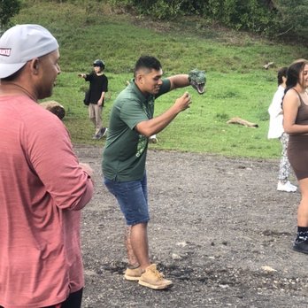 Kualoa Ranch - Our guide Christian making his SLO-mo dinosaur movie. - Tours Near Me - Kaneohe, Hawaii Kualoa Ranch - Our guide Christian making his SLO-mo dinosaur movie. - Tours Near Me - Kaneohe, Hawaii