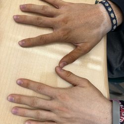 Tommy's Tanning - one hand is michael jackson in 71 and one is Jackson in 04