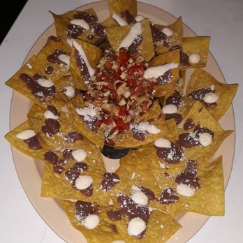 Polaris Cafeteria - a plate of nachos with chocolate and nuts - Cuban Near Me - Miami, Florida Polaris Cafeteria - a plate of nachos with chocolate and nuts - Cuban Near Me - Miami, Florida