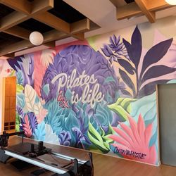 The wall art leading to the restroom