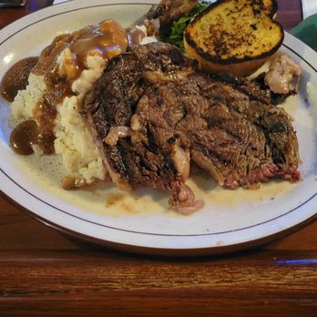 McGonigle's Pub & Grill - Ribeye steak, mashed potatoes w/gravy, garlic. (Also a side salad). - Pubs Near Me - Battle Creek, Michigan