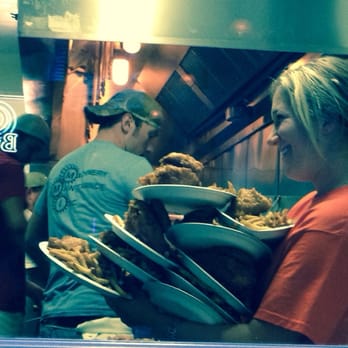 Rip's Tavern - View through the kitchen window. Chicken, hot out of the fryer, on a piece of white bread in case you feel lacking for carbs. - Seafood Near Me - Ladd, Illinois