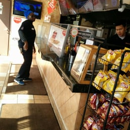 a man standing in front of a counter a man standing in front of a counter