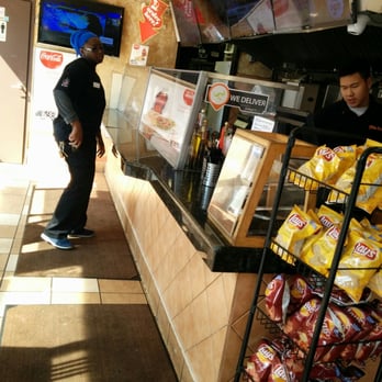 Pita Land - a man standing in front of a counter - Middle Eastern Near Me - Toronto, Ontario Pita Land - a man standing in front of a counter - Middle Eastern Near Me - Toronto, Ontario