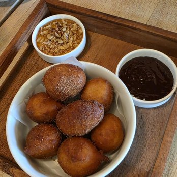 Cava Mezze - Olney - Dessert - Loukoumades. Greek donuts, cinnamon sugar, nutella, honey & walnuts. May 2026. - Mediterranean Near Me - Olney, Maryland Cava Mezze - Olney - Dessert - Loukoumades. Greek donuts, cinnamon sugar, nutella, honey & walnuts. May 2026. - Mediterranean Near Me - Olney, Maryland