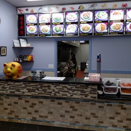 a restaurant counter with a piggy bank