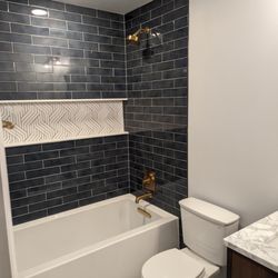 Tile Tub Surround with infinity niche, Kolher Underscore deep soaking tub, with Kolher Casita fixtures.
#MariettaRemodel
#RayConstruction