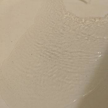 Hyatt Regency Houston - Hard to tell because of the light in the bathroom, but those are dirt particles in the ice cold water in which I had to shower - Hotels Near Me - Houston, Texas