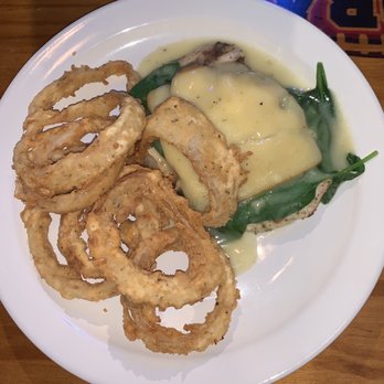 Global Sports Bar - a plate of food with onion rings and gravy - Sports Bars Near Me - LaGrange, Georgia Global Sports Bar - a plate of food with onion rings and gravy - Sports Bars Near Me - LaGrange, Georgia