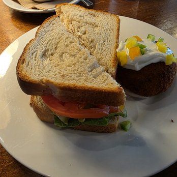 The Basics - Chicken Salad Sandwich on Sourdough with a potato cake - Southern Near Me - Wilmington, North Carolina The Basics - Chicken Salad Sandwich on Sourdough with a potato cake - Southern Near Me - Wilmington, North Carolina