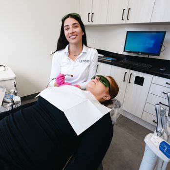 Le Blanc General Dentistry & Aesthetics - Patient getting ready for laser teeth whitening to elevate her smile - Oral Surgeons Near Me - Houston, Texas Le Blanc General Dentistry & Aesthetics - Patient getting ready for laser teeth whitening to elevate her smile - Oral Surgeons Near Me - Houston, Texas