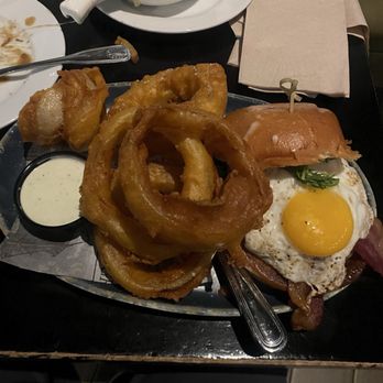 The State - Drunken Pig Burger w/ onion rings - Whiskey Bars Near Me - Rancho Cucamonga, California The State - Drunken Pig Burger w/ onion rings - Whiskey Bars Near Me - Rancho Cucamonga, California
