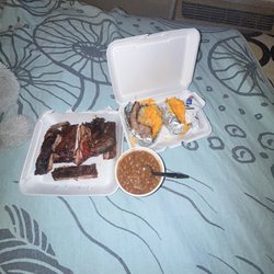 1/2 Slab Of Smoked Ribs Baked Potato Bar-B-Q Beans...