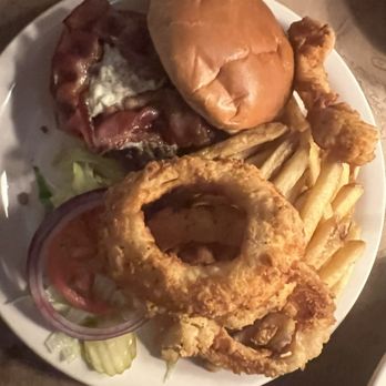 Ted's Montana Grill - Bison burger with half onion rings and half fries - American Near Me - Nashville, Tennessee Ted's Montana Grill - Bison burger with half onion rings and half fries - American Near Me - Nashville, Tennessee