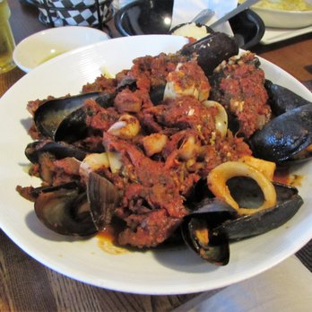 Bookstore & Restaurant - (mussels, scallops, calamari and linguica in a spicy red sauce over linguini) - Seafood Near Me - Wellfleet, Massachusetts Bookstore & Restaurant - (mussels, scallops, calamari and linguica in a spicy red sauce over linguini) - Seafood Near Me - Wellfleet, Massachusetts
