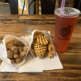 Popcorn chicken, waffle fries, strawberry green tea with strawberry boba Popcorn chicken, waffle fries, strawberry green tea with strawberry boba