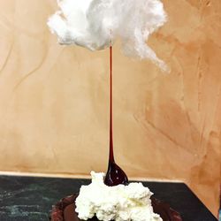 Sun City Chef - We call this the cloud dessert. Double chocolate tart with caramel, whipped cream, candied hazelnut and white cotton candy