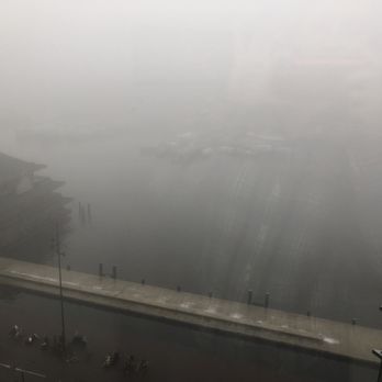 DoubleTree by Hilton Amsterdam Centraal Station - View on a foggy day. - Hotels Near Me - Amsterdam, New Hampshire