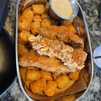 Topgolf - Crispy Chicken Strips. Usually comes with fries but we got tator tots instead. - Golf Near Me - San Jose, California Topgolf - Crispy Chicken Strips. Usually comes with fries but we got tator tots instead. - Golf Near Me - San Jose, California