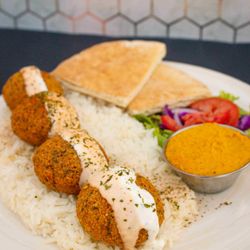 Extreme Hummus Rancho - Falafel Plate: Crispy falafel with rice, creamy hummus, and fresh salad.