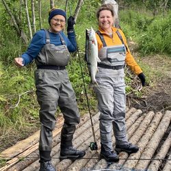Bill White's Alaska Sports Lodge - The two best fishermen on site with Ogie & Michelle in front of their cabins!