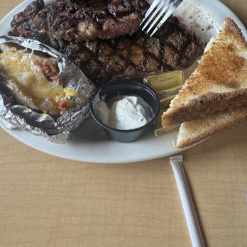 Peppermill Bar & Grill - Ribeye, Texas, toast, and loaded baked potato. - American Near Me - Rawlins, Wyoming