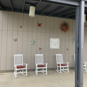 Social Pet - Rocking Chair front Awning - Pet Boarding Near Me - Pineville, North Carolina Social Pet - Rocking Chair front Awning - Pet Boarding Near Me - Pineville, North Carolina