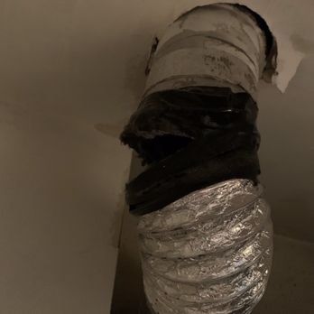 Dapper Ducts - The previous owner attached the dryer hose with electrical tape... bad move. - Air Duct Cleaning Near Me - Washington, DC, District of Columbia