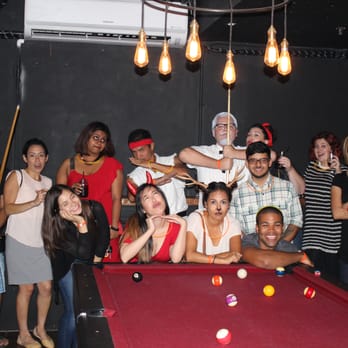 OC Crawl - a group of people standing around a pool table - Walking Tours Near Me - Santa Ana, California OC Crawl - a group of people standing around a pool table - Walking Tours Near Me - Santa Ana, California