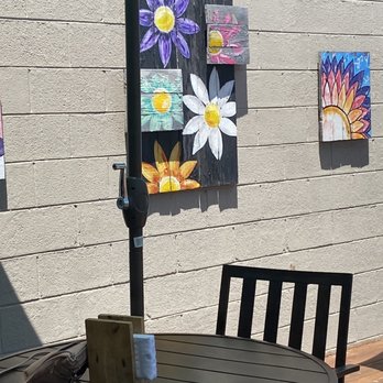 Back Porch Bistro - Art work displayed on deck - Sandwiches Near Me - Ellijay, Georgia Back Porch Bistro - Art work displayed on deck - Sandwiches Near Me - Ellijay, Georgia