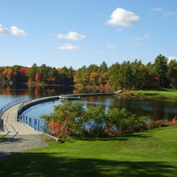 Seguin Valley Golf Club - The 7th hole. 208 yard par 3 from the back tee over a lake. Large sweeping floating bridge from tee to green.